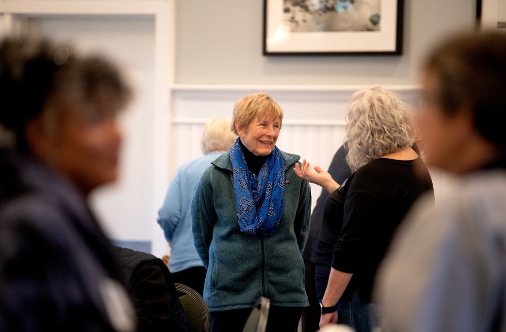 Sue Neat smiling as she talks to Susan Proctor